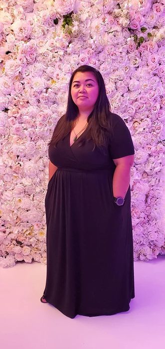 reviewer showcasing the black dress