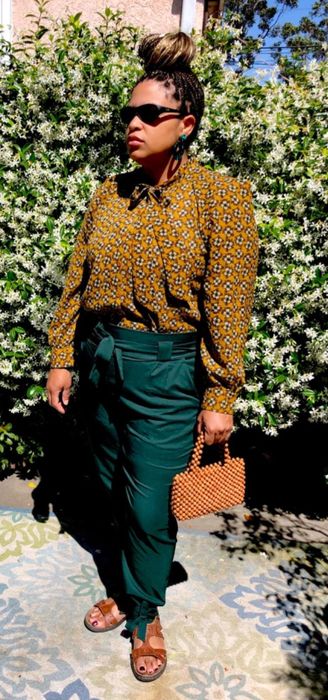 Reviewer showcasing the dark green pants