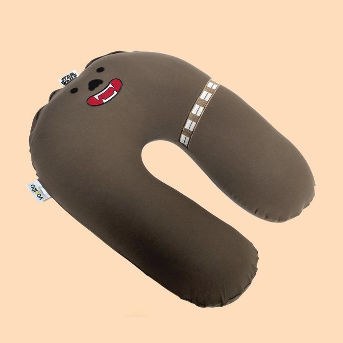 A brown Chewbacca-shaped support pillow.