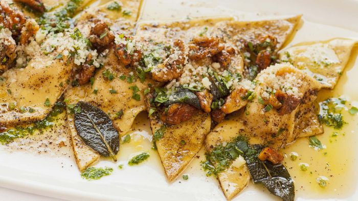 Triangular ravioli drenched in a sage-infused butter sauce.