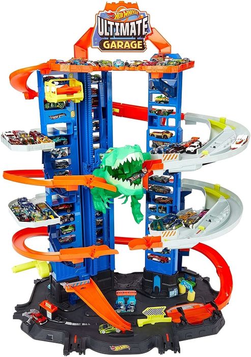The Hot Wheels garage featuring a racetrack and a dinosaur.