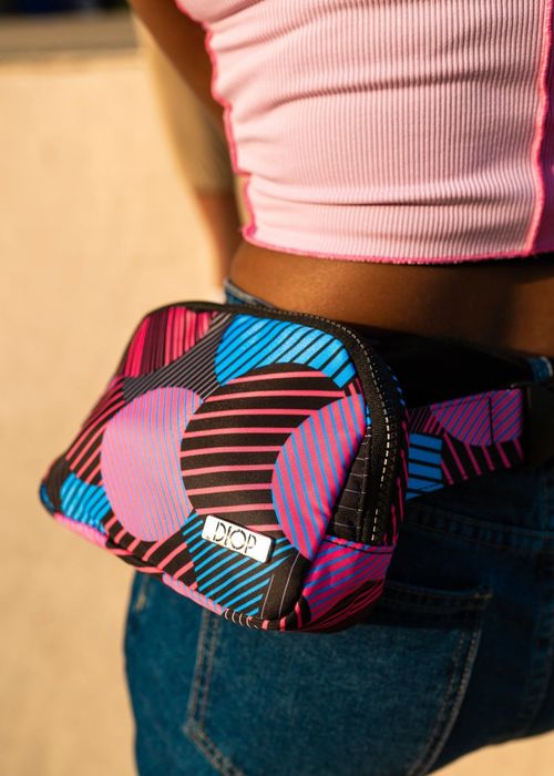 a close-up of the Akira fanny pack worn by a model