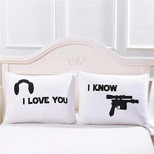 The two pillowcases: one features Princess Leia’s iconic hairstyle with 'I love you', while the other says 'I know' with a blaster.