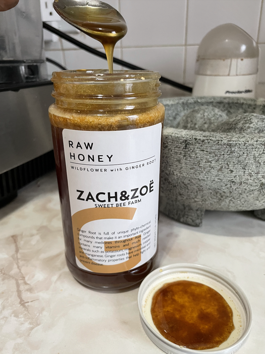 an image of an open jar of ginger honey