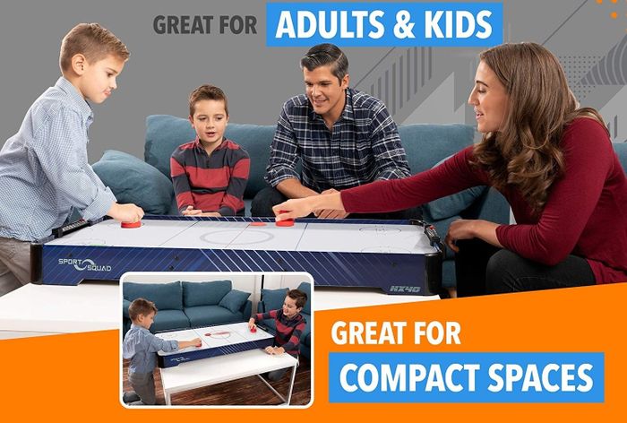 A fun-filled moment with both kids and adults enjoying the tabletop game together.