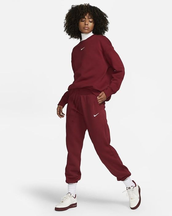 Image of model wearing red sweatpants