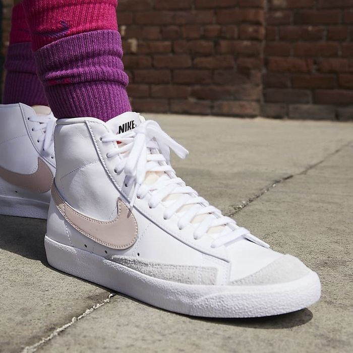 Image of model wearing white sneakers