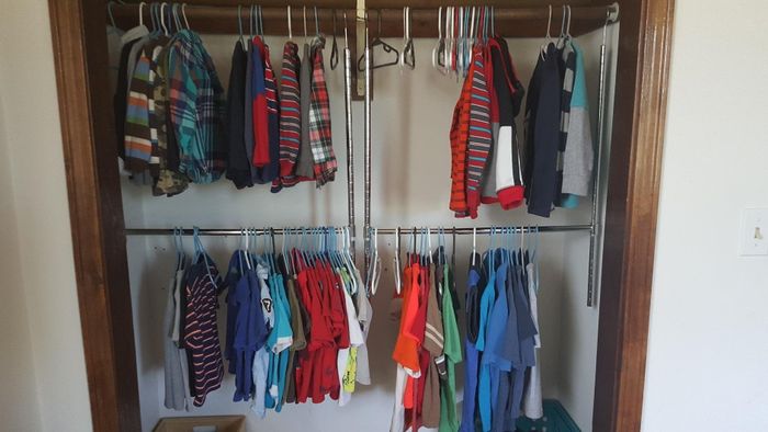 A reviewer’s closet featuring two rods installed for added hanging space.