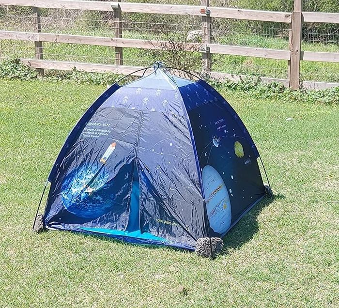 A reviewer's photo of a tent set up outdoors.