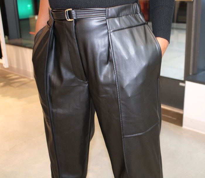 a close-up view of the elastic waistband on the model