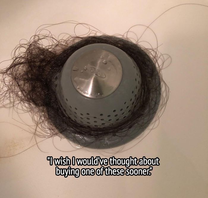 The drain stopper with collected hair and text