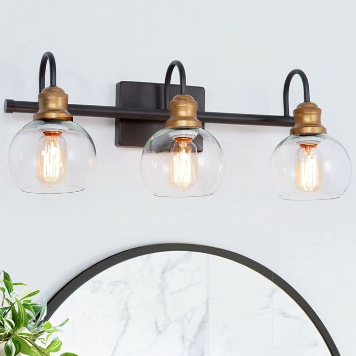 the vanity lights installed above a mirror