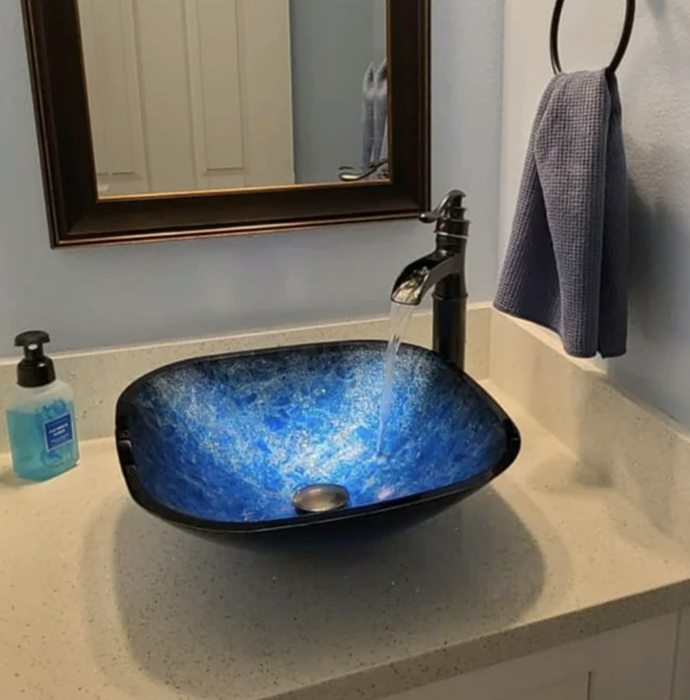 The blue sink displayed in a reviewer's bathroom.