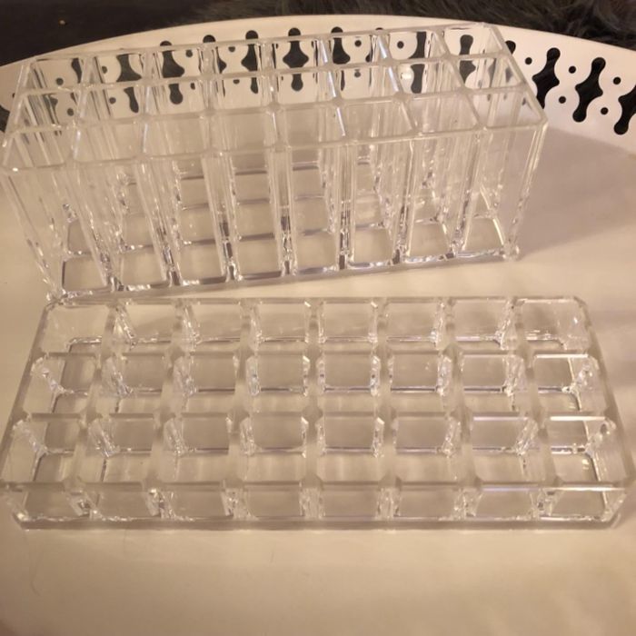 Transparent acrylic makeup organizers with multiple compartments, designed to neatly store and organize your cosmetics.