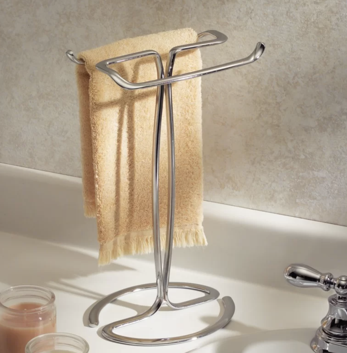 A hand towel is neatly displayed on a towel rack