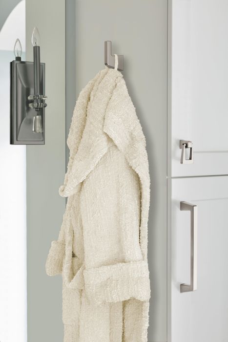 a robe draped over the wall-mounted hook