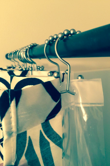 A photo from a reviewer showing the hooks in their shower.