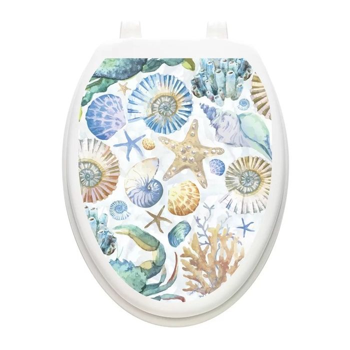 A toilet seat decal decorated with seashells for a touch of coastal charm.