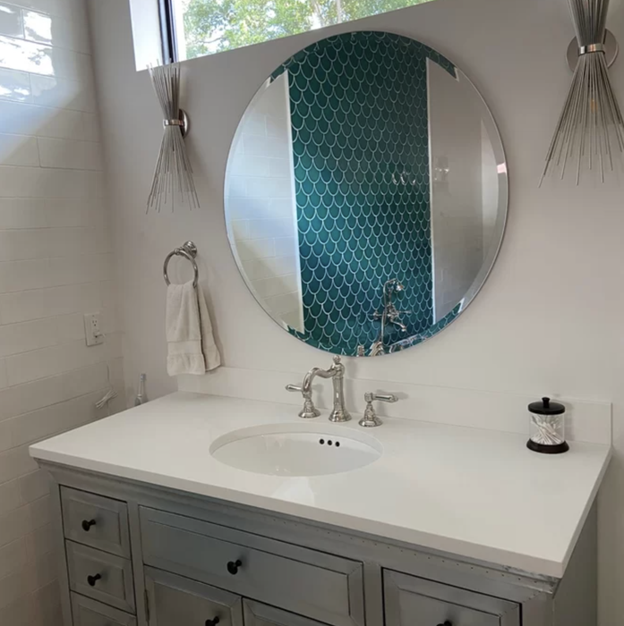 image from a reviewer showing the mirror hanging above a sink