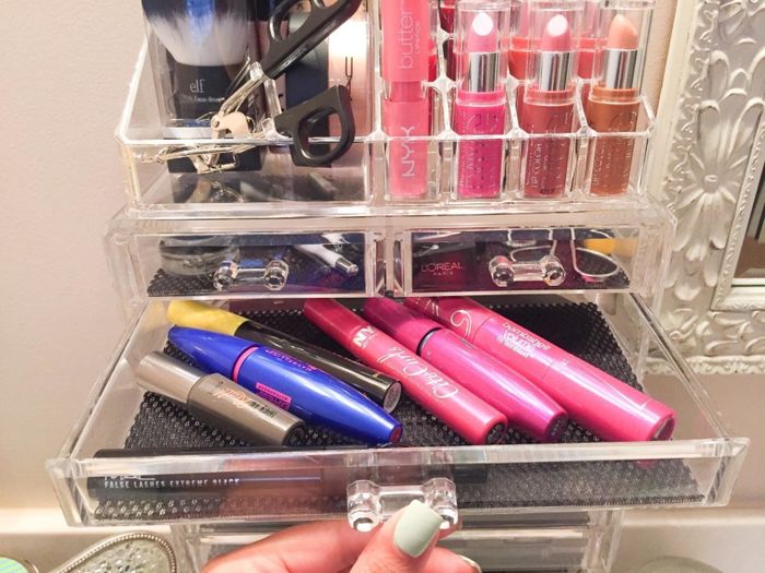 One of the drawers filled with mascaras