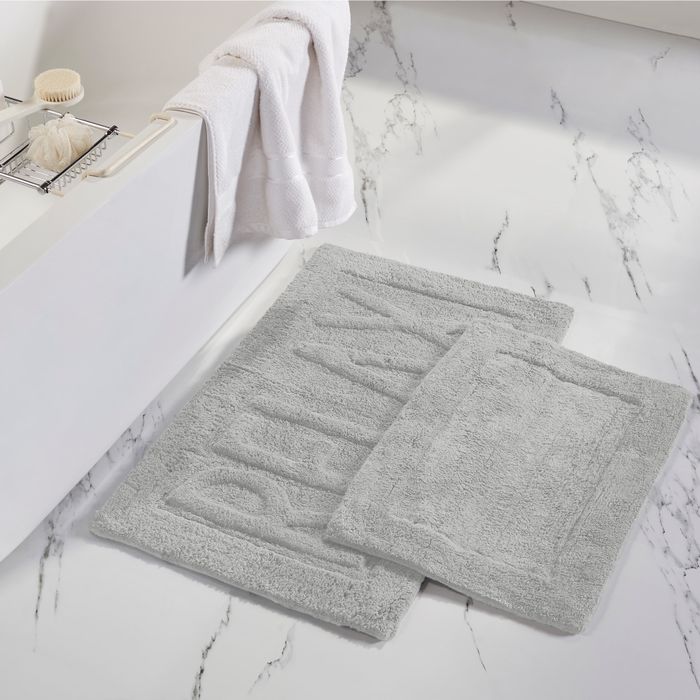 the bath set featuring a large rug with the word 'relax'