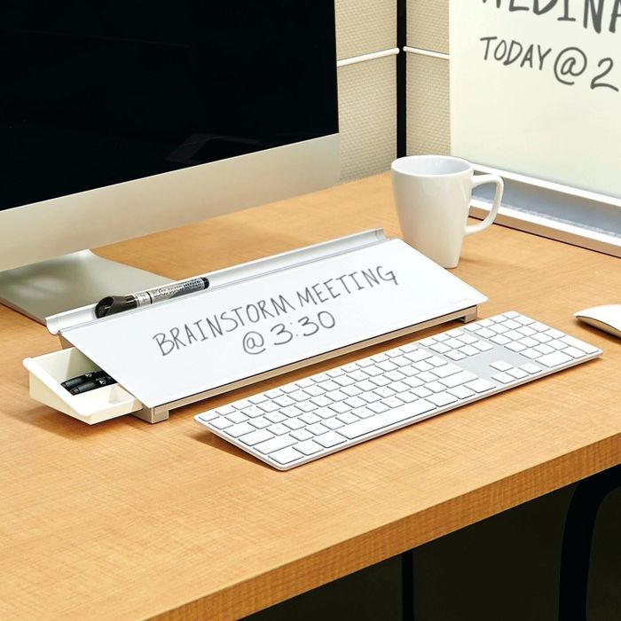 the dry-erase whiteboard placed on a desk with the message 