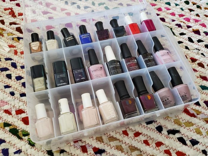 An image shared by a reviewer showcasing their neatly arranged nail polish collection