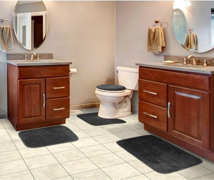A bath rug, shower rug, contour rug, toilet seat cover