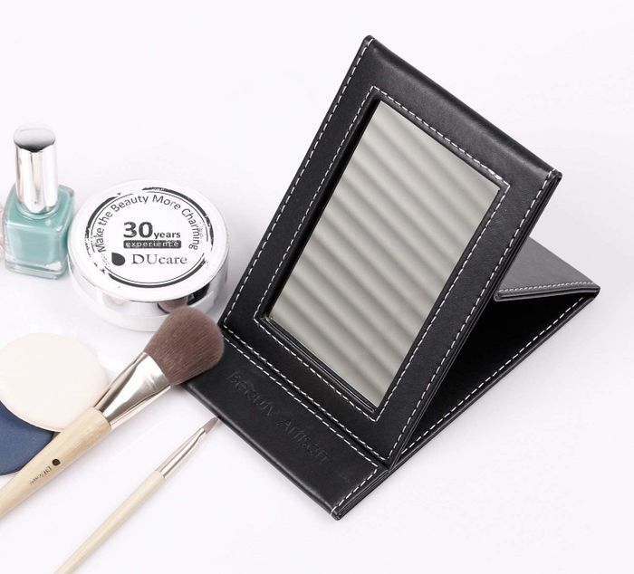Desk mirror placed on a white table
