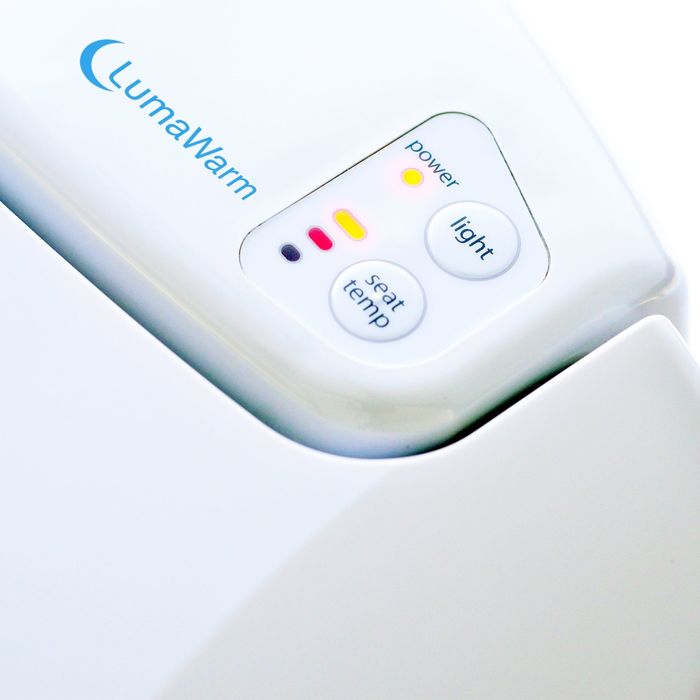 a detailed view of the control buttons on the heated toilet seat