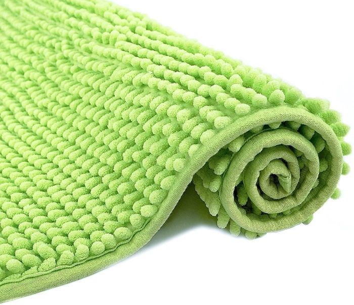 A rolled-up neon green bath mat.