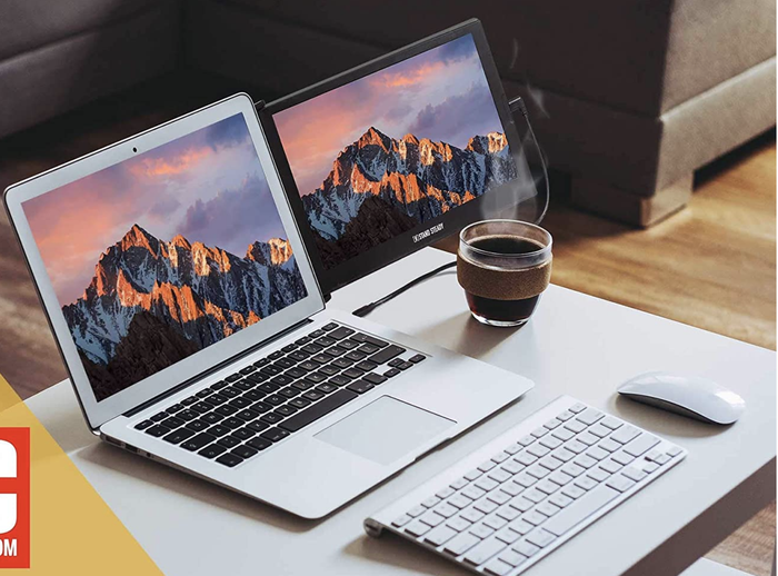 A laptop with a compact black monitor attached to the existing screen on a desk