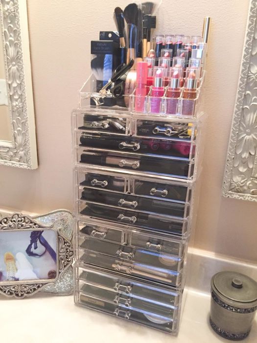An extra-tall makeup cabinet packed with cosmetics
