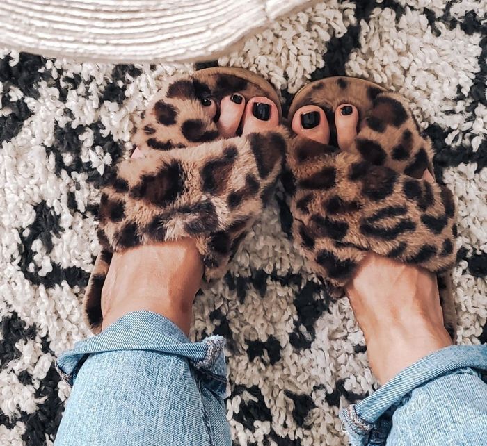 reviewer wearing leopard slippers