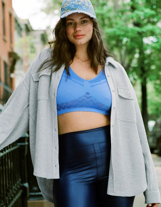 A model wearing a gray waffle knit top