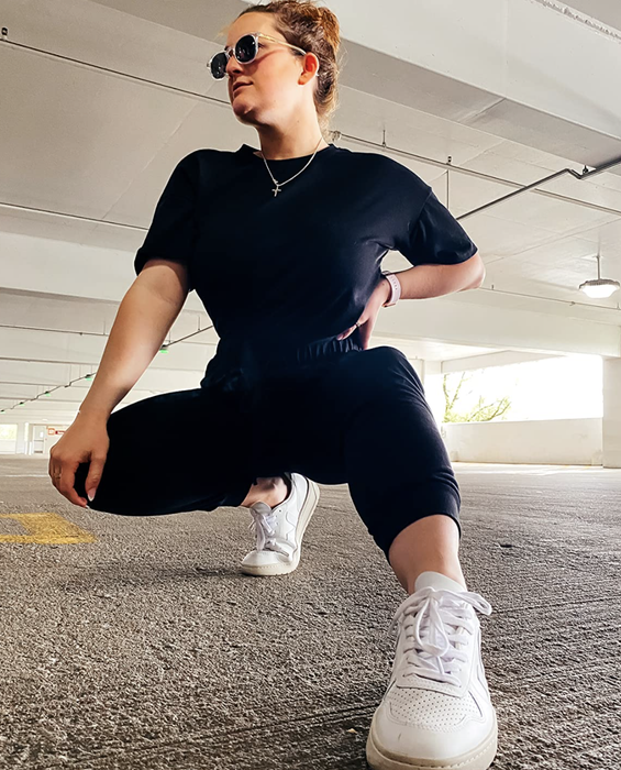 A reviewer sporting the black version of the set