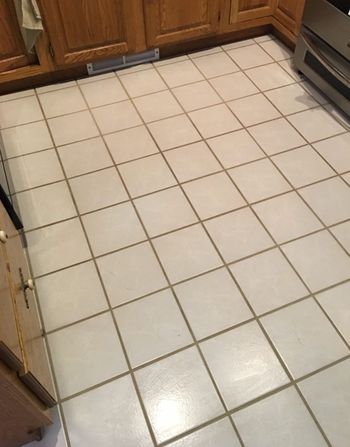 A reviewer’s tile floors, stained and grimy from grout buildup