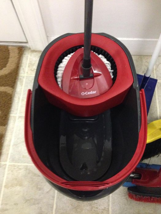 A spin mop in action in a bathroom