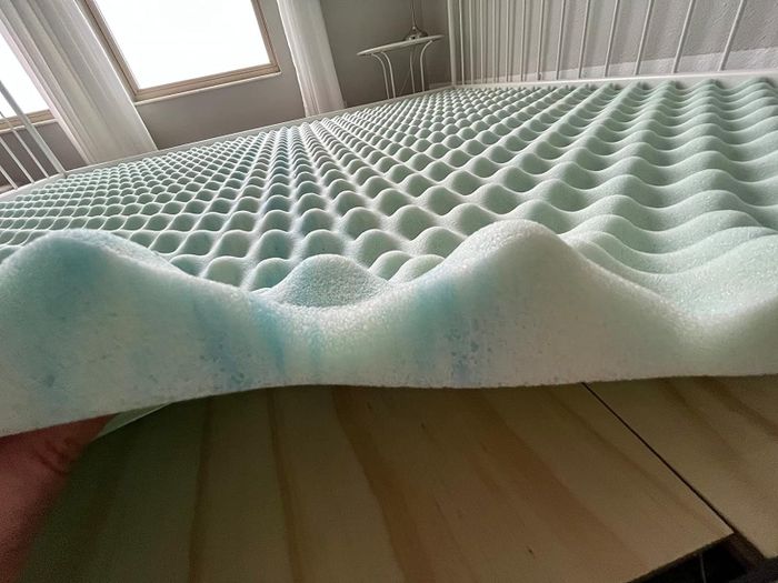 A close-up of the mattress topper, highlighting its thickness