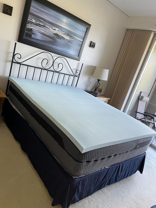 A mattress topper placed on a queen-sized bed