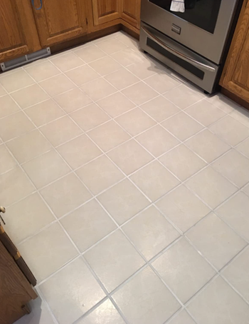 The same tile floor now spotless and fresh after using the grout pen