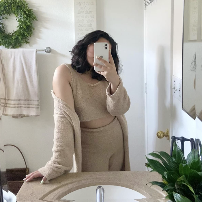 A customer photo of them wearing the set in camel