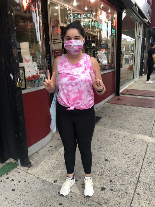 Mytour editor wearing black leggings and a pink tie-dye tank top
