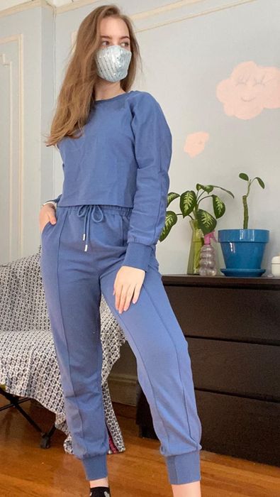 Another reviewer in a matching blue sweat set