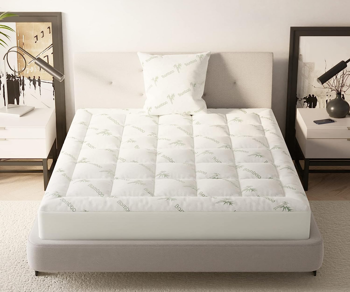 A bamboo mattress topper placed on a mattress