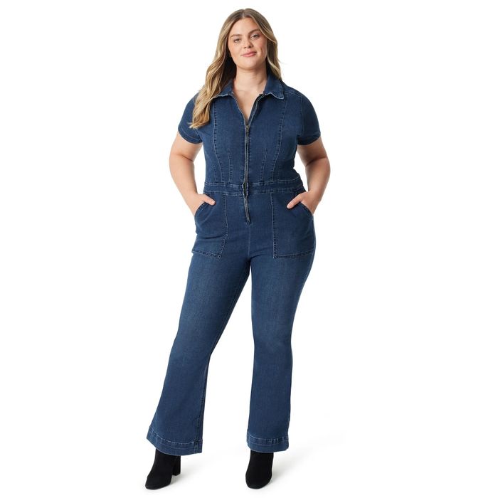 A person confidently wearing a trendy denim jumpsuit with functional pockets, perfect for casual outings or a shopping trip.
