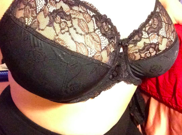 A customer review image showing them wearing the bra in black.