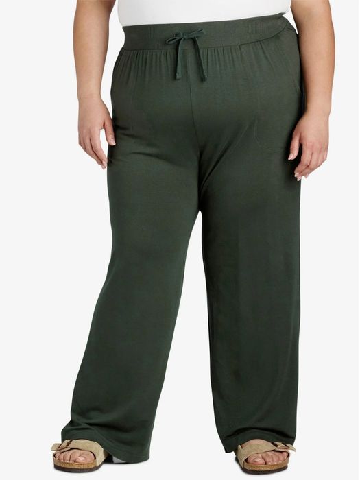 Person wearing relaxed, comfy pants with a drawstring waist, perfect for casual outings or lounging at home. Sandals are visible on the feet
