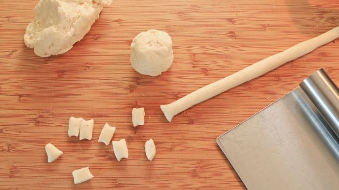 Dough formed into a long rope, then chopped into gnocchetti.