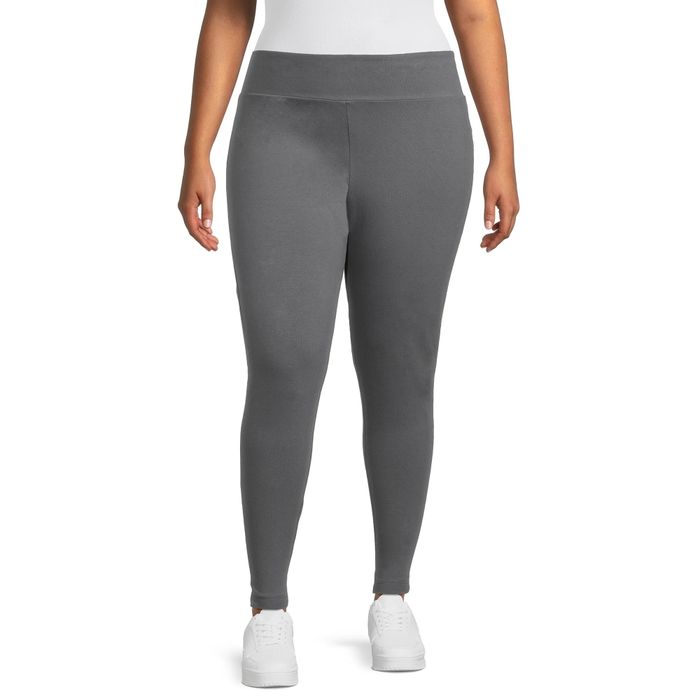 Person wearing gray leggings and white sneakers, rocking a comfortable athletic look
